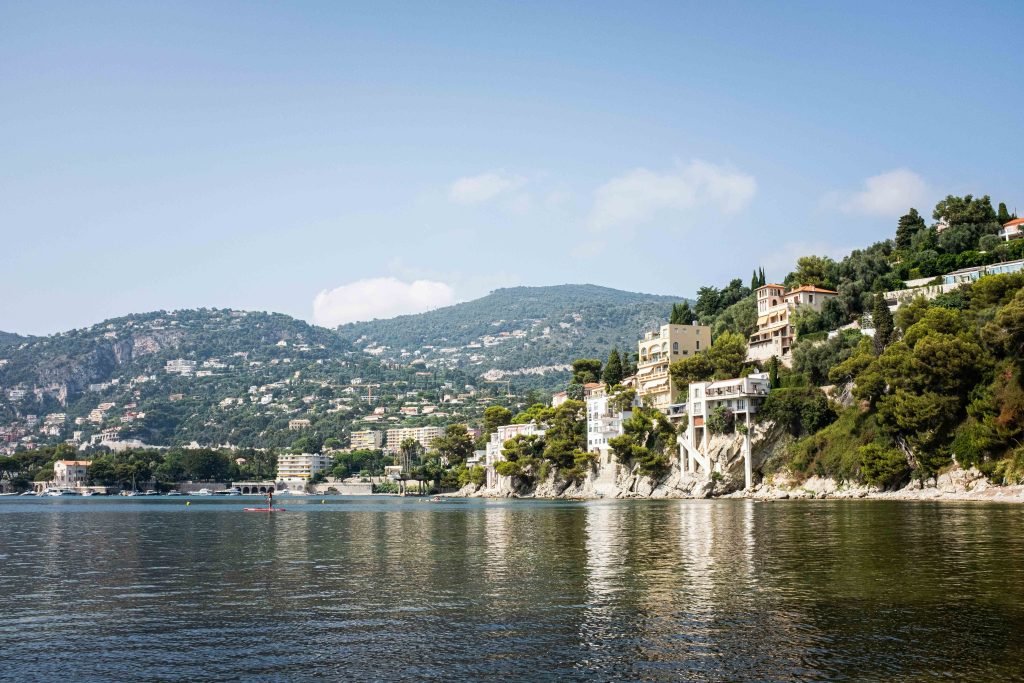 Panoramic view of the hills and luxury villas overlooking the Mediterranean Sea, near Villefranche-sur-Mer on the Côte d'Azur. Typical coastal landscape of southern France 